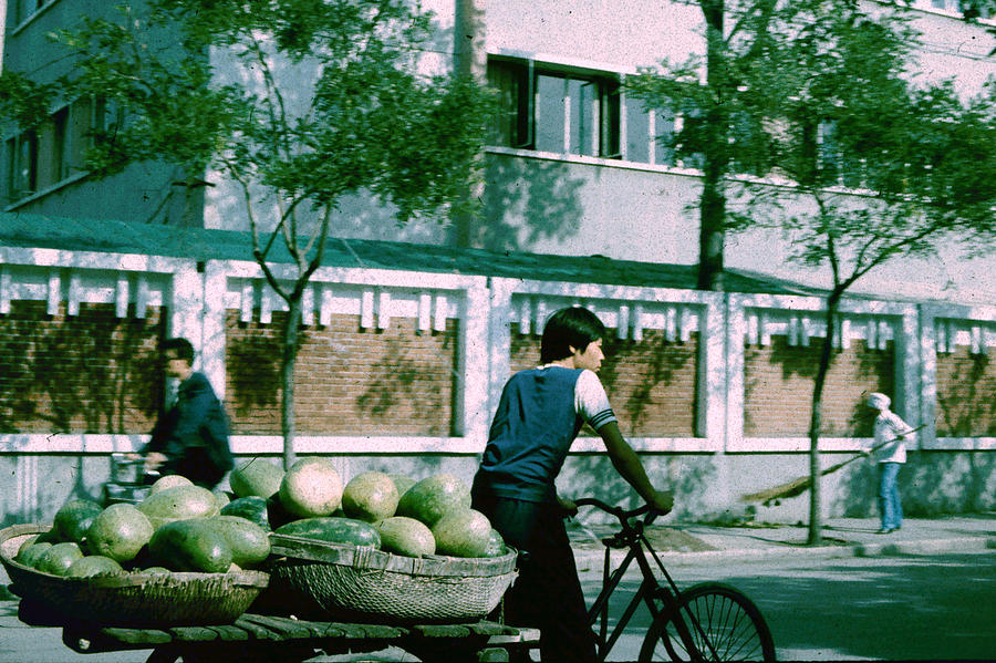 Bicyclist with Baskets of Watermelons Photograph by John Warren