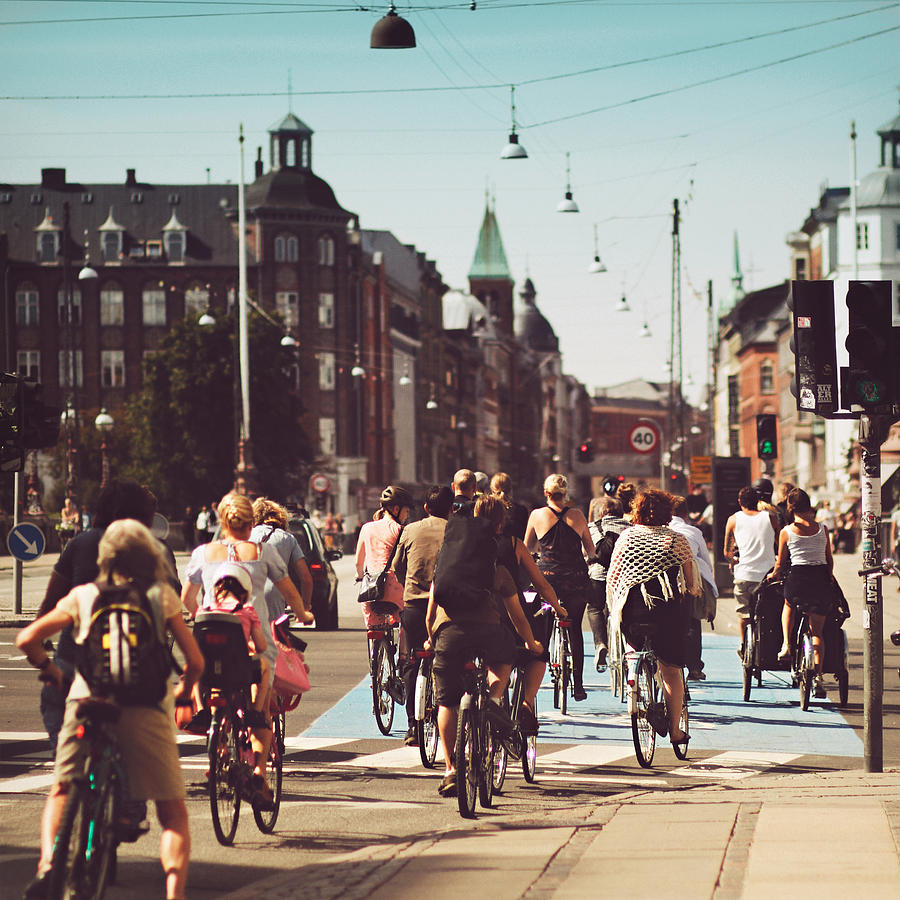 Bicyle riders on street in Copenhagen Photograph by Julia Davila-Lampe