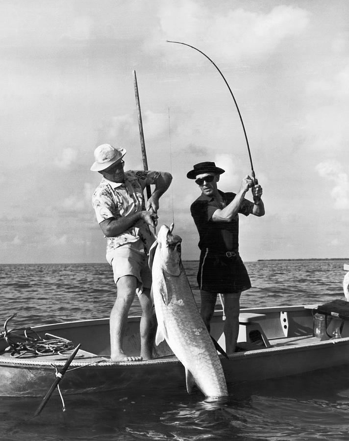 Big Fish For A Small Boat Photograph by Underwood Archives