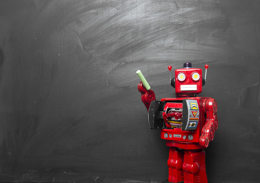 Big red robot toy teaches his class , Photograph by Charles Taylor