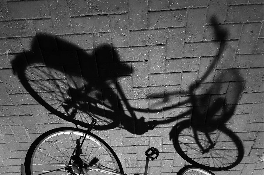 Bike Shadow Flipped Photograph by Lauren Rathvon