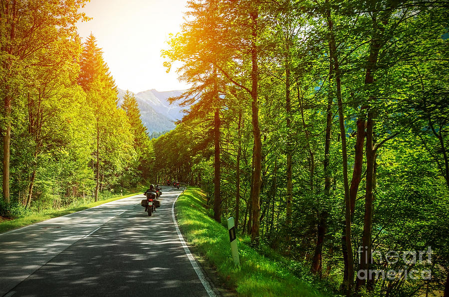 Biker on mountainous road Photograph by Anna Om