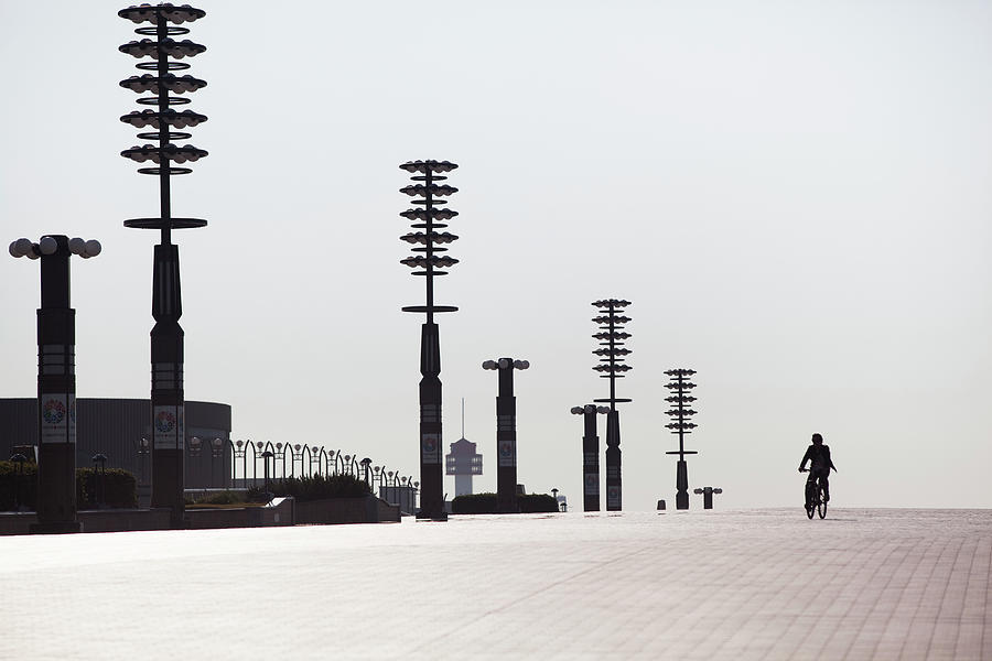 Biker Running On The Pavement Photograph by Hiroshi Watanabe