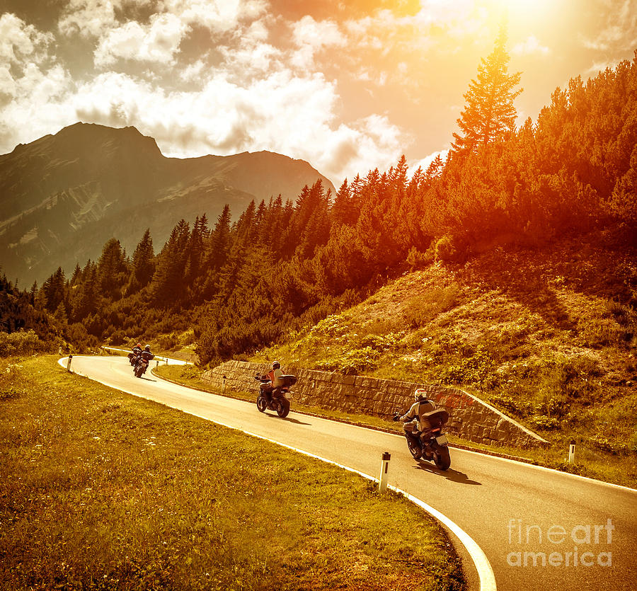 Bikers on mountains road in sunset Photograph by Anna Om
