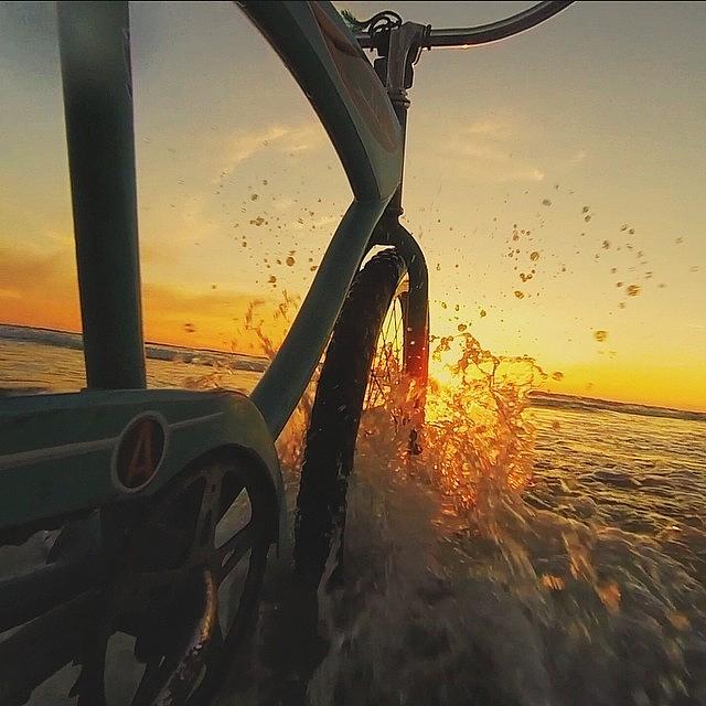 Sunset Photograph - Biking In The Oregon Coast. by Tilion Lieberman