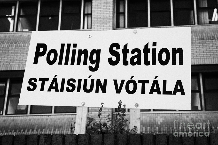 City Photograph - Bilingual Irish Polling Station Sign Dublin Republic Of Ireland by Joe Fox