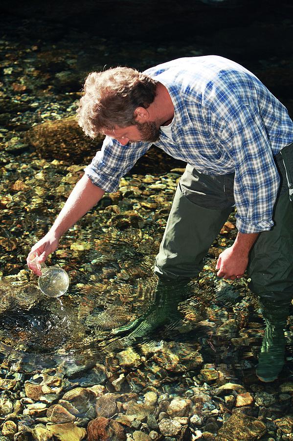 Biologist Collecting A Water Sample Photograph by Mauro Fermariello/science Photo Library