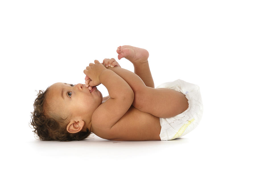 Biracial Baby Sucking his Toes Isolated on white Photograph by Lostinbids