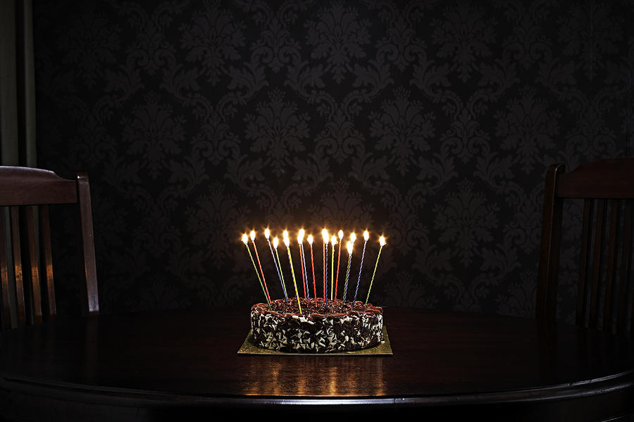 Birthday Cake On Table In Living Room Photograph by Martin Poole
