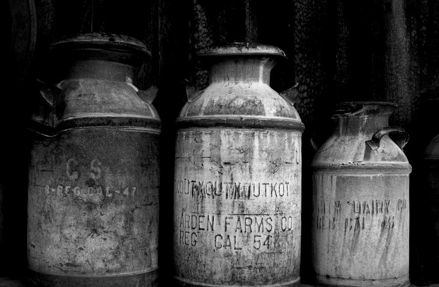 Black And White Antique Milk Cans Photograph by Marilyn Diaz