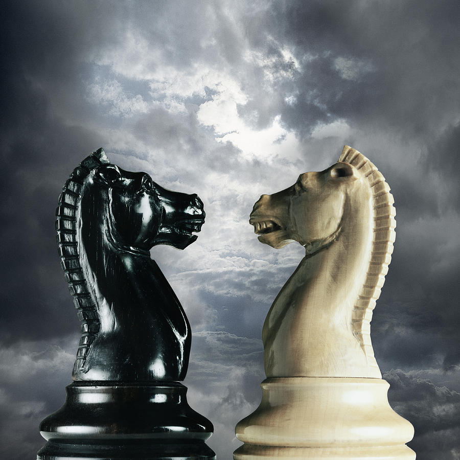 Black and White Knight Chess Pieces Snarling at Each Other, Stormy Sky in the Background Photograph by Digital Zoo