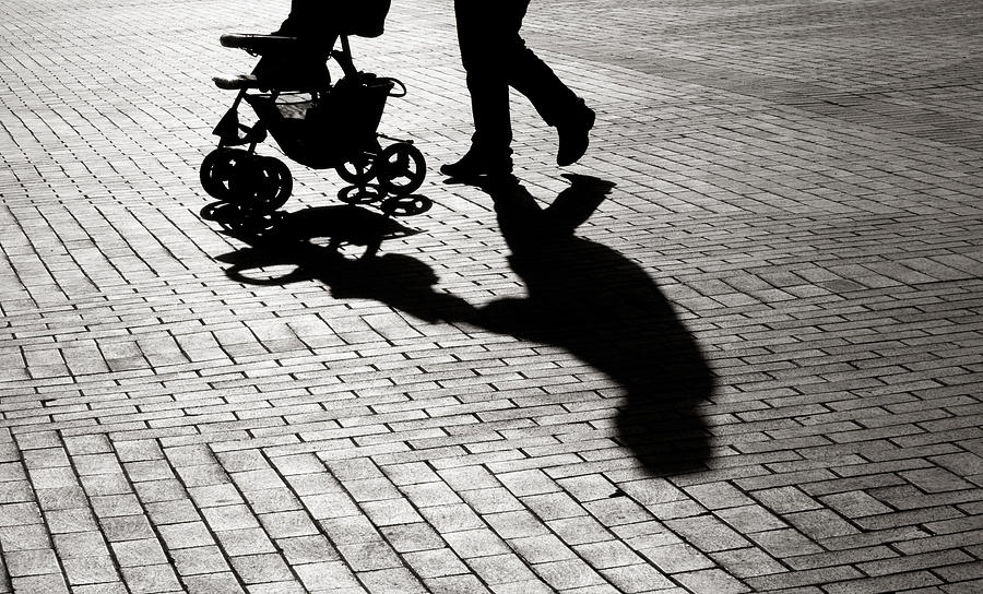 Black And White Shadow Of Baby Carriage On Sidewalk Stones Photograph by Selimaksan