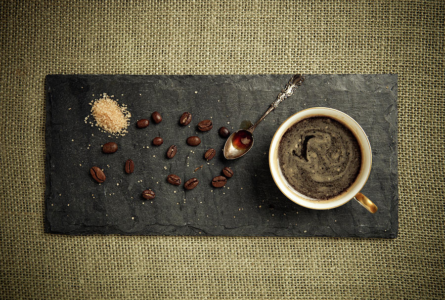 Black Espresso And Coffee Beans Photograph by Jorgegonzalez