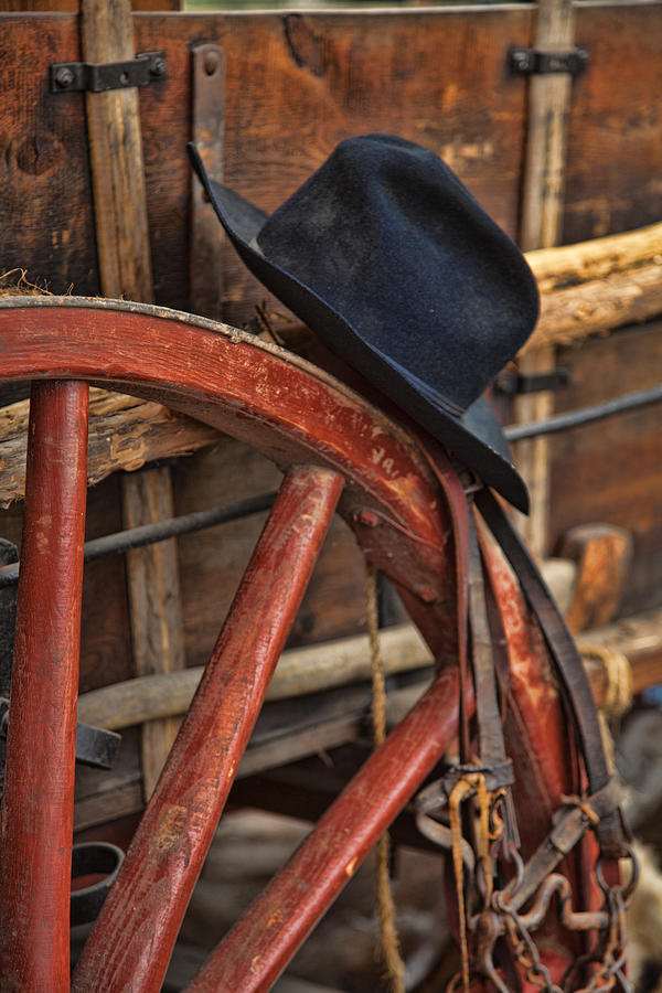 Black Hat on a Red Wagon Wheel Photograph by Toni Hopper