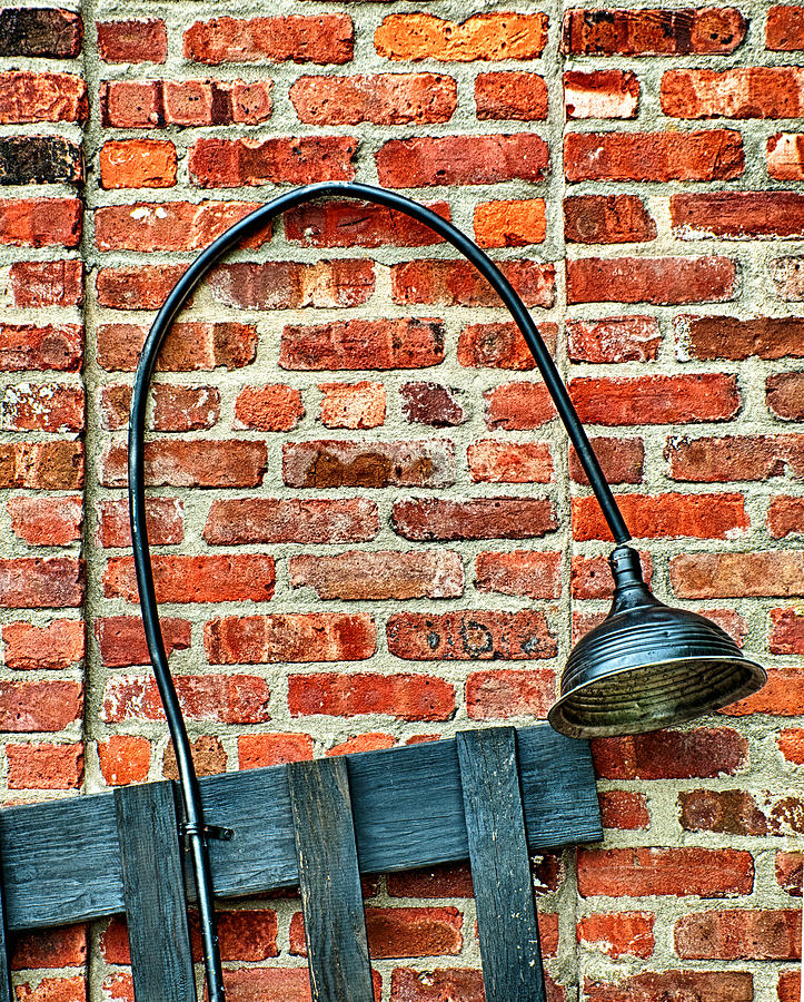 Black Lamp Against Brick Wall Photograph by Gary Slawsky