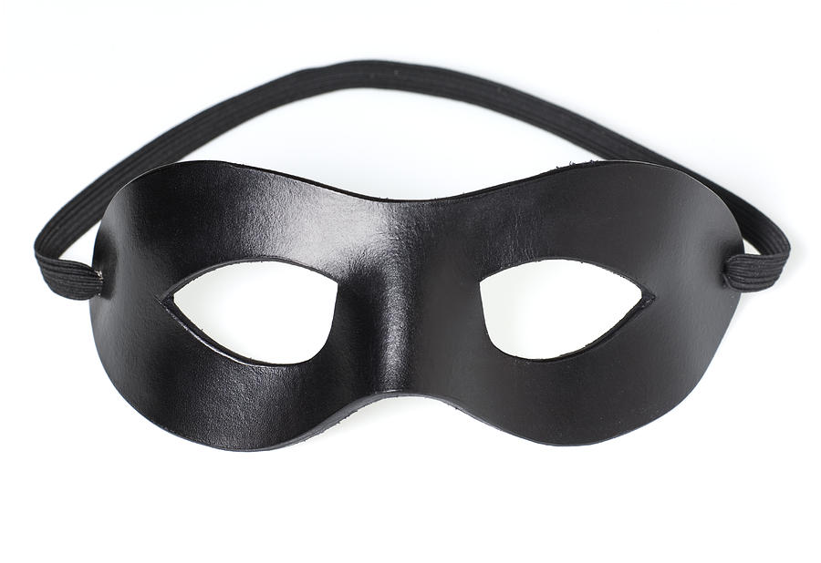Black leather bandit mask isolated on white. Photograph by Timothy Hughes