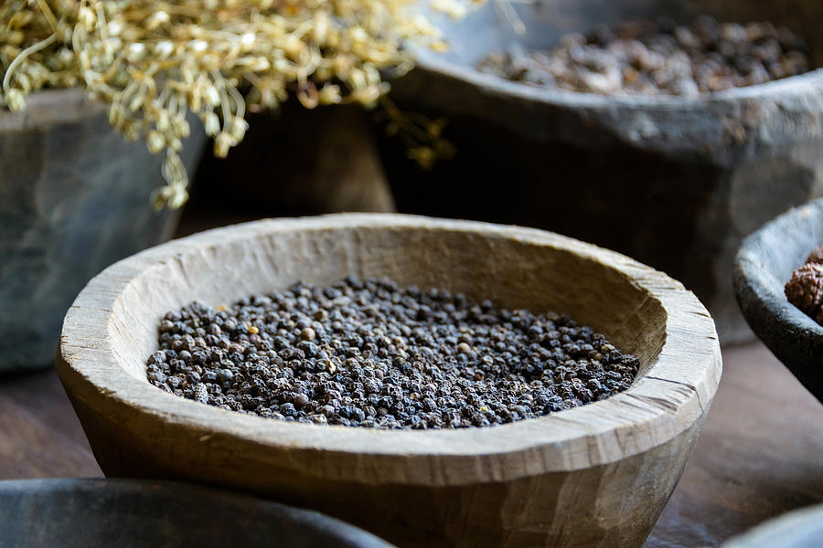 Black pepper in a wooden bowl Photograph by Dutourdumonde Photography