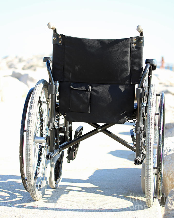 Black Wheelchair From Behind With Rubber Wheels Photograph by Fed Cand