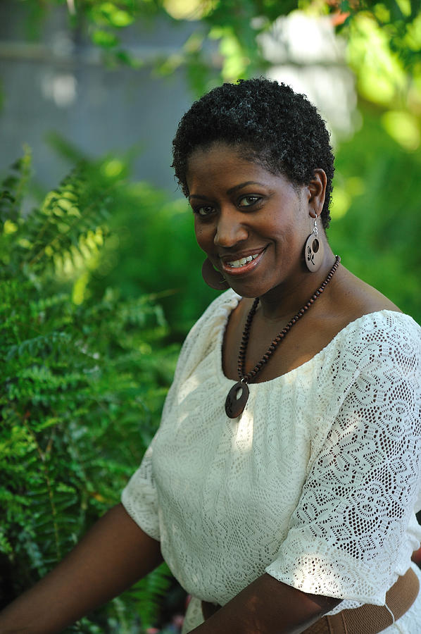 Black woman in a garden Photograph by PacoRomero