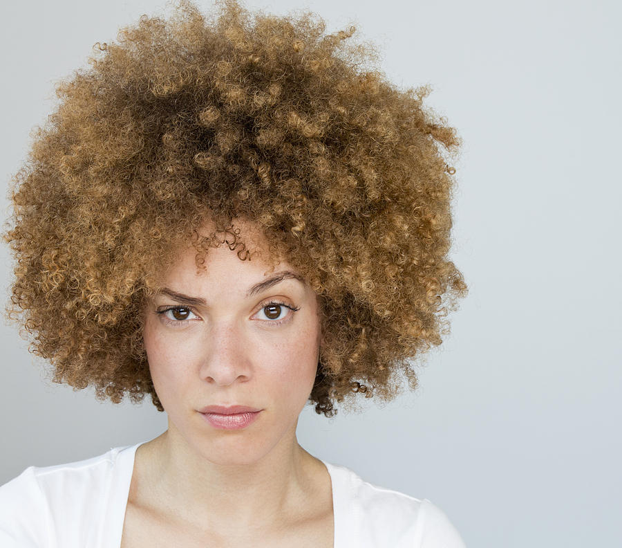 Black woman raising her eyebrow Photograph by Ariel Skelley