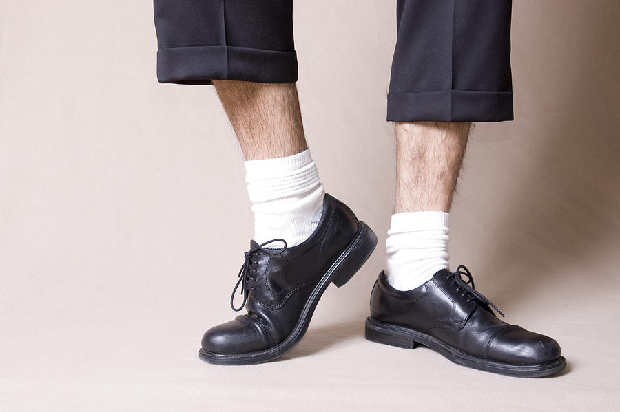 Black work shoes with white socks and ankles Photograph by Bbeltman