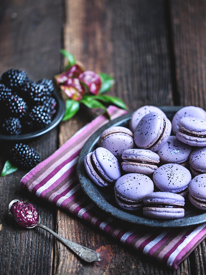 Blackberry macarons on a rustic wooden table. Photograph by IngredientsPhoto