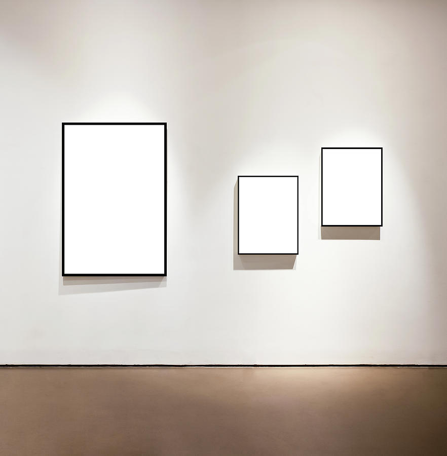 Blank frames on the wall at art gallery Photograph by Loonger