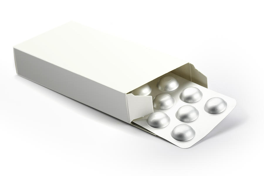 Blisters With Pills In A Box Isolated On White Photograph by Republica