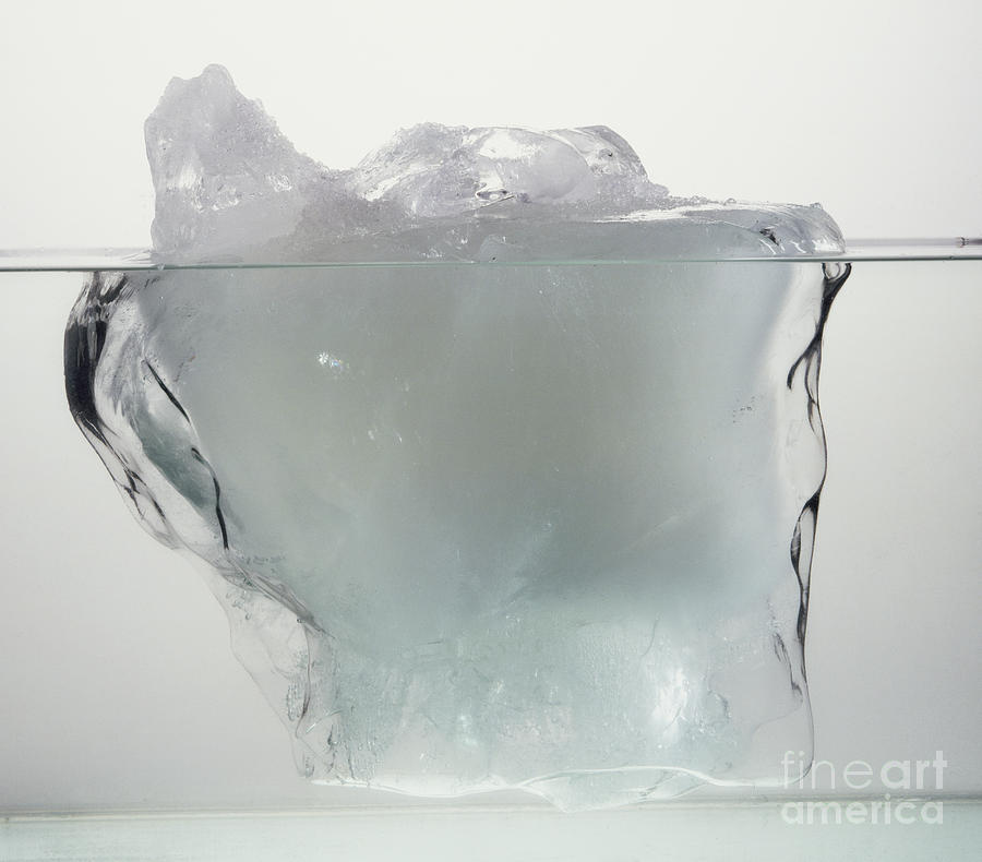 Block Of Ice In Water Photograph by Dorling Kindersley