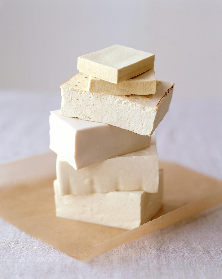 Blocks of tofu arranged in stack Photograph by Victoria Pearson