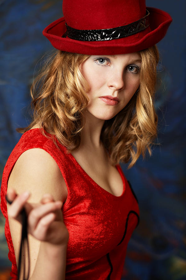 Portrait Photograph - Blond woman in a red hat by Radka Linkova