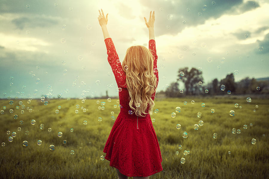 Blonde Girl Enjoying Nature with Spread Arms Surrounded with Bubbles Photograph by AleksandarGeorgiev