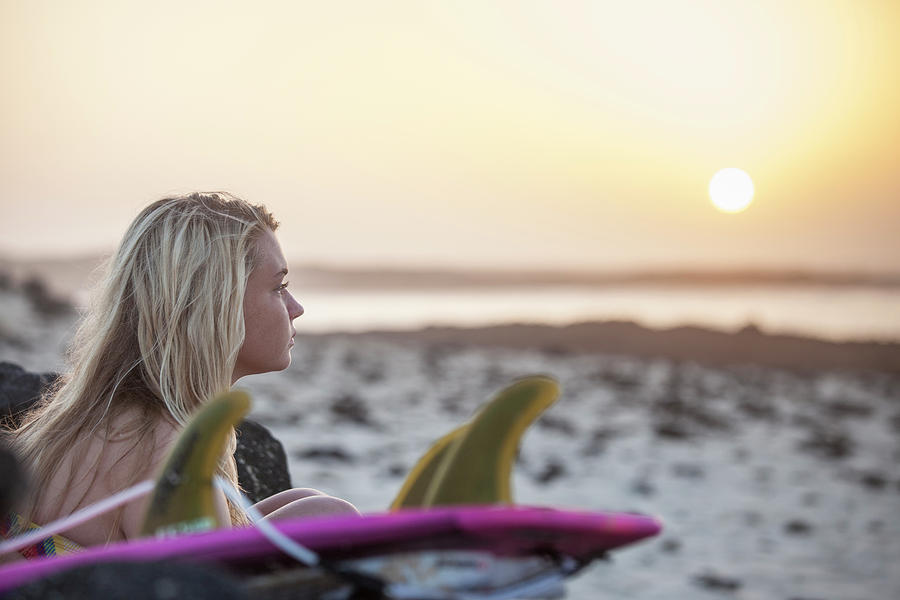 Blonde Surfer Girl Sitting On The Beach Photograph By Mauro Ladu