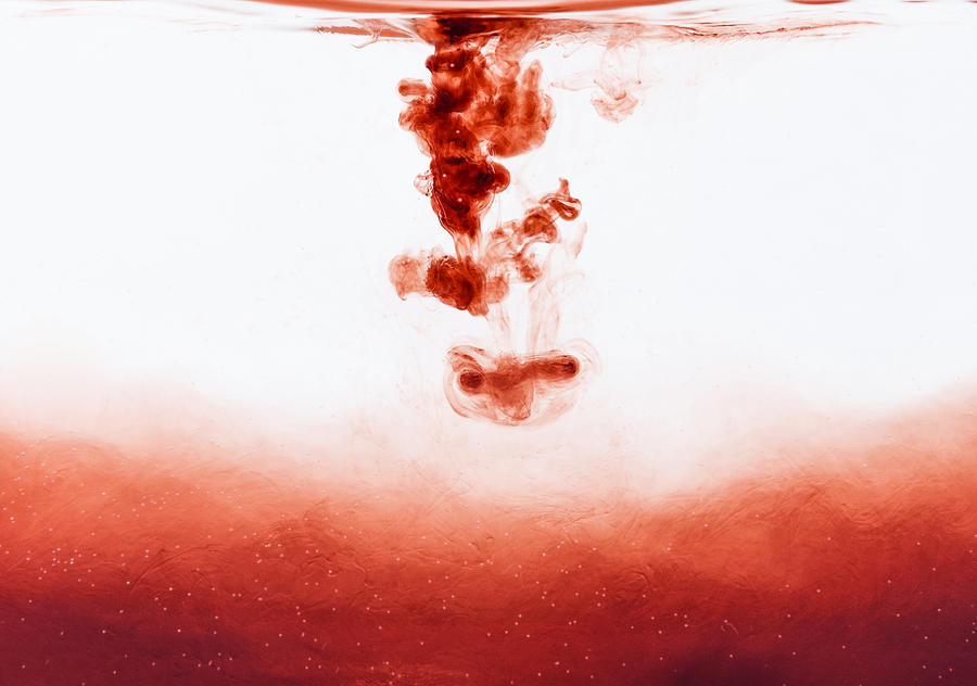 Blood drop falling into water Photograph by StockImages_AT