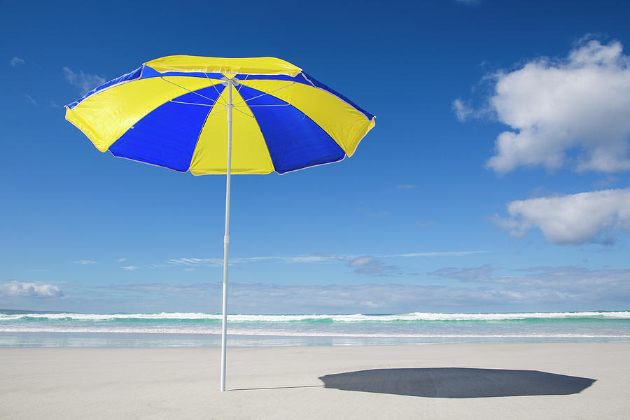 Blue And Yellow Beach Umbrella Photograph by John White Photos