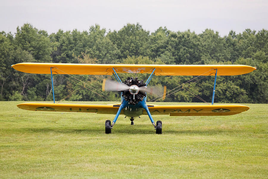 Blue and Yellow biplane Photograph by Jack Nevitt