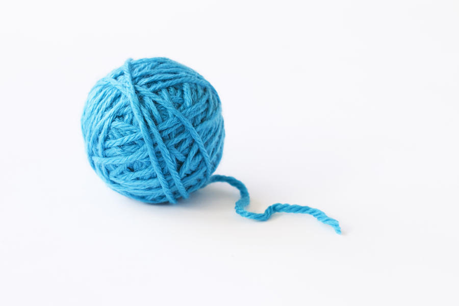 Blue ball of wool, studio shot Photograph by A&Me