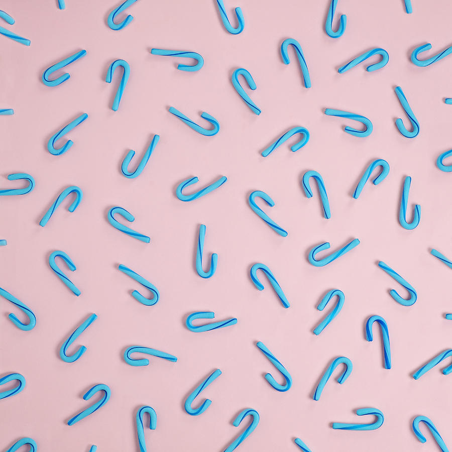 Candy Photograph - Blue Candy Canes On A Pink Background by Juj Winn