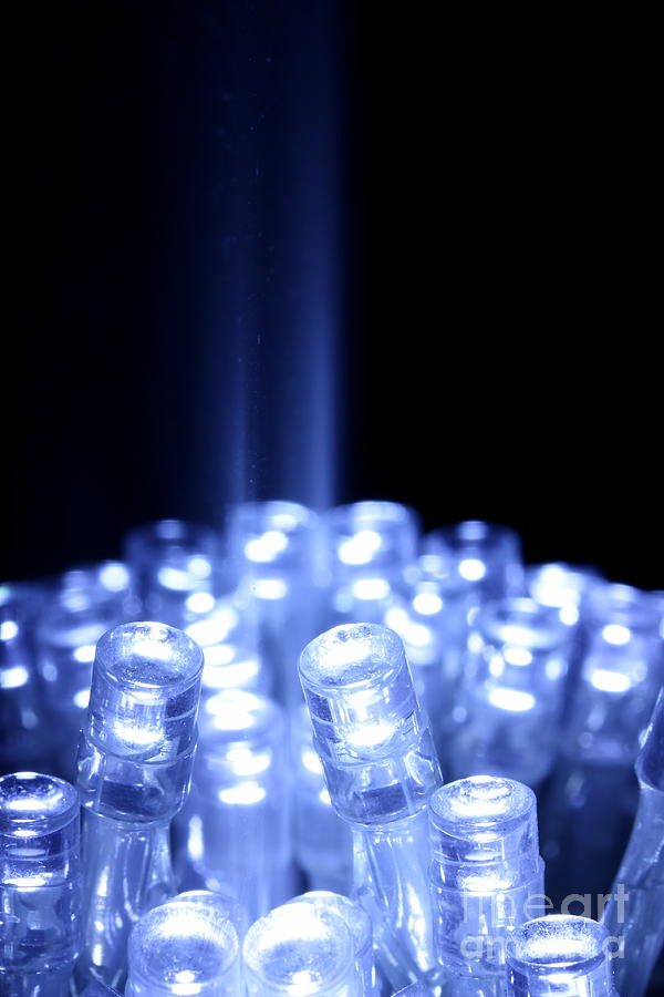 Blue LED lights with light beam Photograph by Simon Bratt