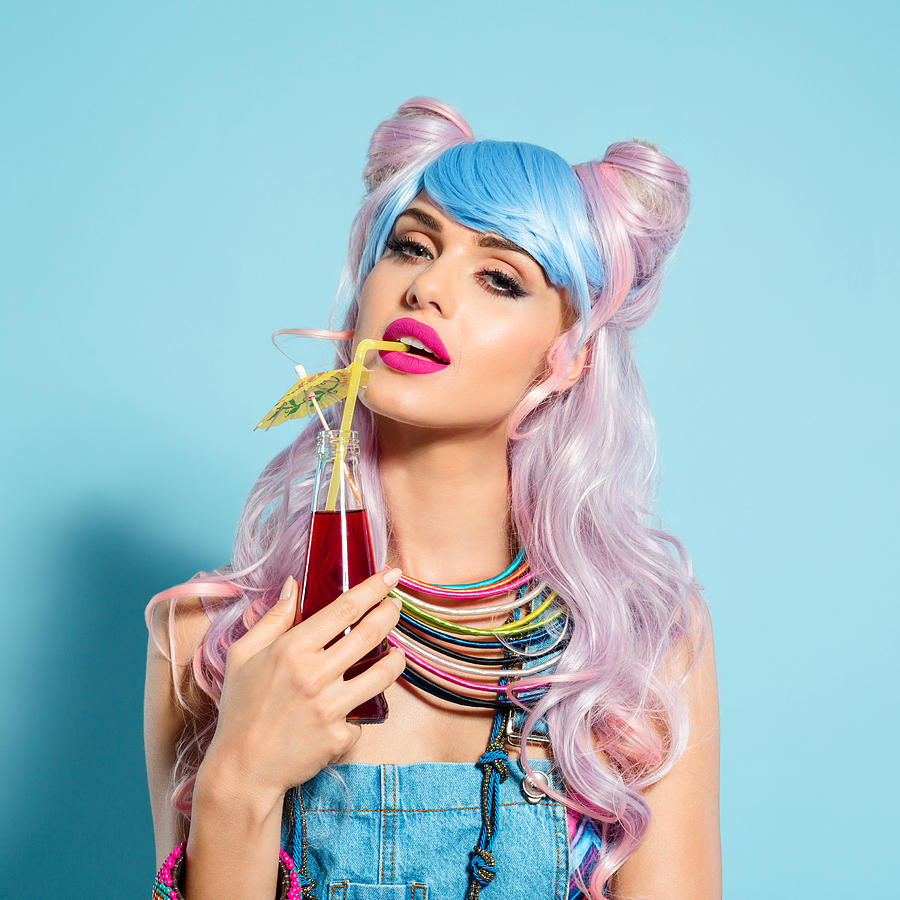 Blue-pink hair girl in funky manga outfit holding summer cocktail Photograph by Izusek