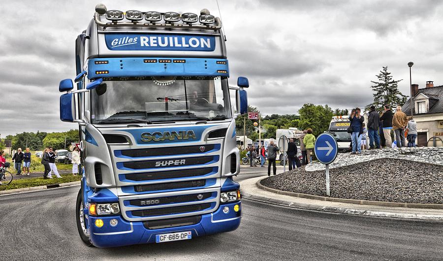 Blue Scania R500 European cabover truck going round a roundabout in France Photograph by Mick Flynn