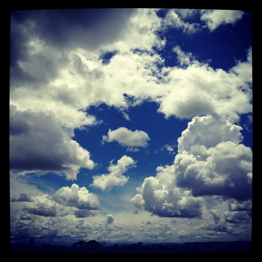 Blue Sky Filled With Fluffy White Clouds Photograph by Jodie Griggs
