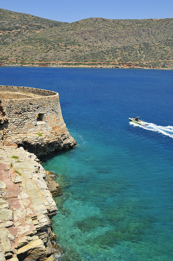 Blue water and boat - Spinalonga Island Crete Greece Photograph by Matthias Hauser
