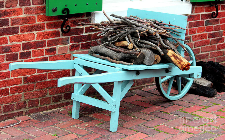 Blue Wheel Barrow with Kindling and Logs at Fort McHenry Photograph by Cynthia Snyder