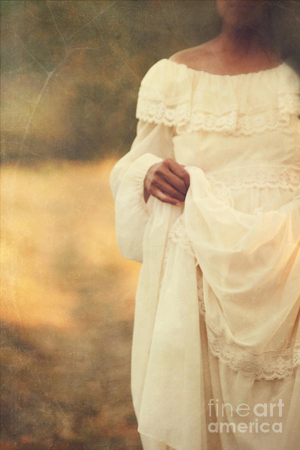 Blurred image of a woman in long dress Photograph by Sandra Cunningham
