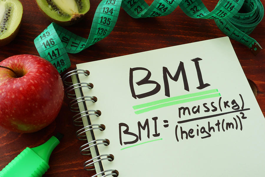 BMI body mass index written on a notepad sheet. Photograph by Designer491