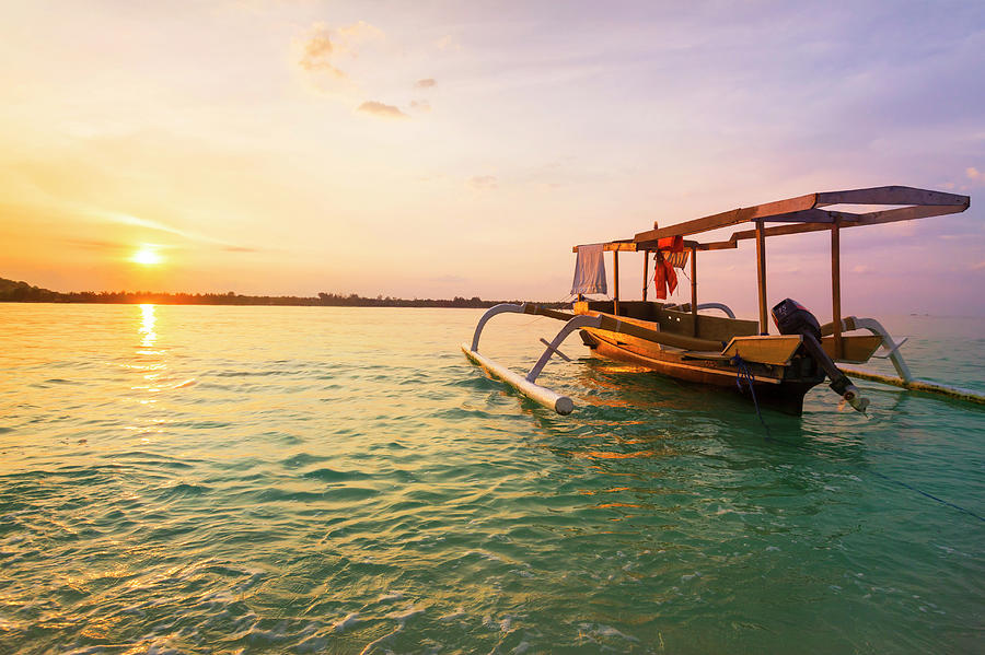 Boat At Sunset In Gili Islands Photograph by Marcos Welsh