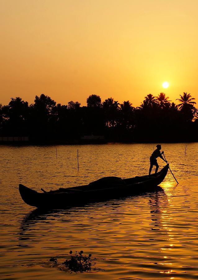 Boat at the Kerala Backwaters at sunset Photograph by Niels Photography