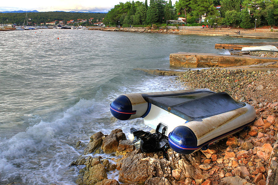 Boat crashed on the sea shore after strong storm Photograph by Brch Photography