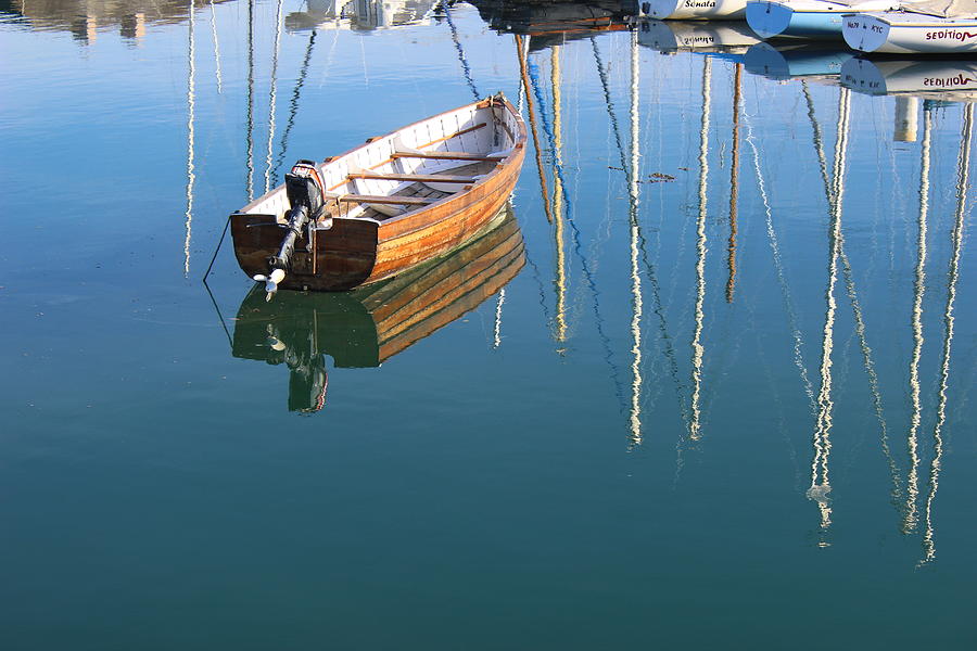 Boat on calm water Photograph by Toni and Rene Maggio